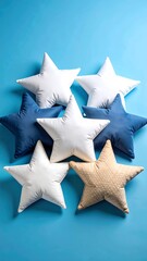 Starshaped pillows with blue background.