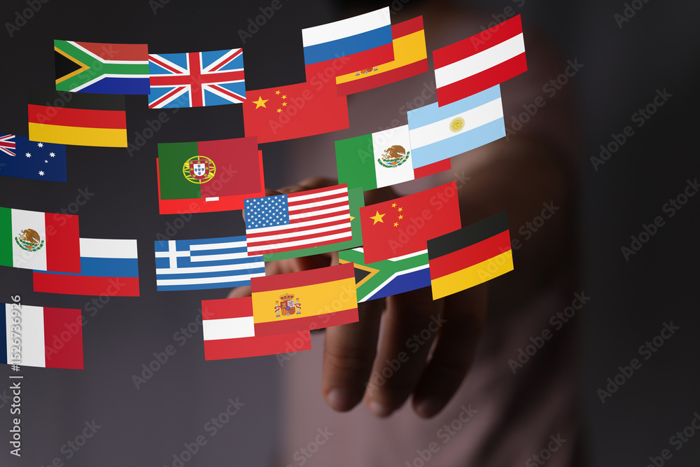 Poster image of a hand interacting with various country flags, representing global business and internation