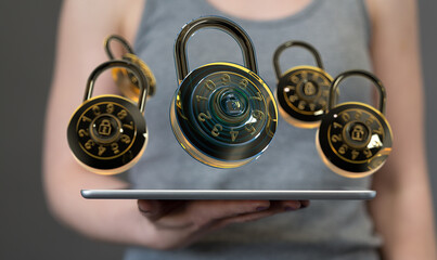 Image of multiple combination locks hovering above a tablet, symbolizing data security and...