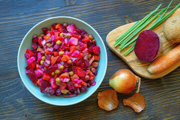 Vinaigrette, vegetable salad based on beets. Ingredients on a cutting board, flat lay, copy space