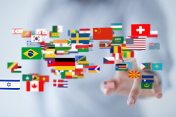 Image of diverse national flags floating around a hand, symbolizing global connectivity and...