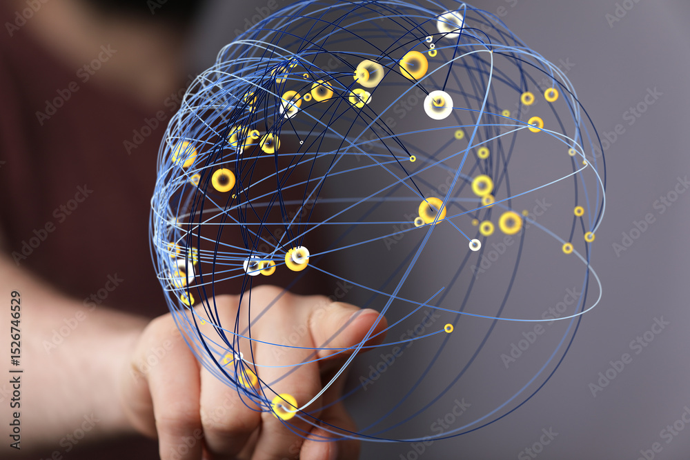 Aufkleber Abstract image of a hand interacting with a digital sphere representing global network connections and data.
