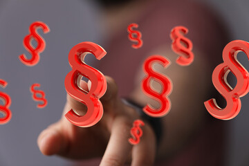 Red paragraph symbols float, illustrating legal concepts, law, regulations, and compliance.