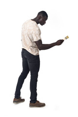 Naklejka premium side view of a standing man painting something imaginary