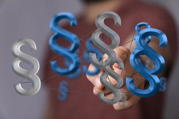 Abstract image of interconnected paragraph symbols, representing legal networks, law, and...