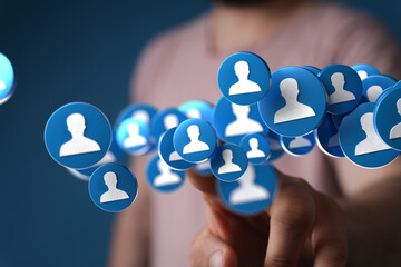 Person interacting with digital network of social media profiles.  Concept of online community and...