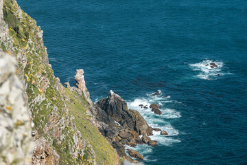 Steep slopes, cliffs surrounded by the ocean