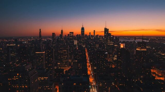 Aerial Cityscape at Twilight Showcasing Skyscrapers against a Gradual Orange and Blue Sky with Illuminated Structures