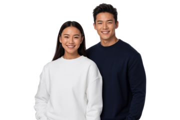 Smiling young Asian couple in casual outfits standing together on isolated background, showing happiness, togetherness, and modern lifestyle