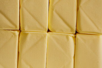 High-quality image of neatly arranged butter sticks, perfect for food blogs and culinary websites.