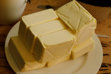 High-quality image of multiple blocks of fresh butter, perfect for culinary websites or food blogs.