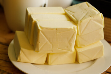 High-quality image of fresh butter blocks, perfect for culinary websites or food blogs.
