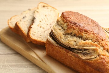Cut banana bread on wooden table, closeup