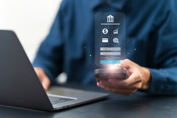 Online banking, login, protection and online payment. Businessman uses a smartphone with a digital banking login interface, while also working on a laptop. Digital Wallet. Mobile banking, e-commerce.