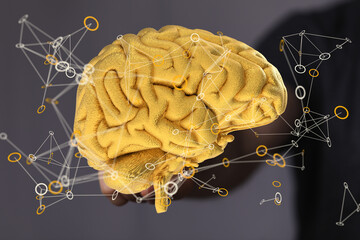 Abstract image of a golden brain with connecting lines, representing neural networks and intelligence.