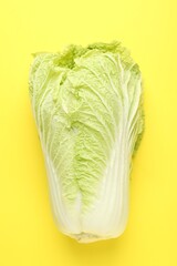 Fresh Chinese cabbage on yellow background, top view