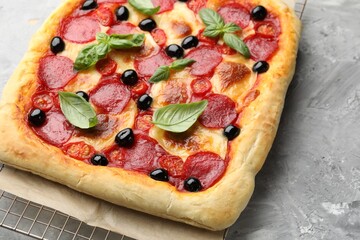 Tasty homemade pizza on grey table, closeup