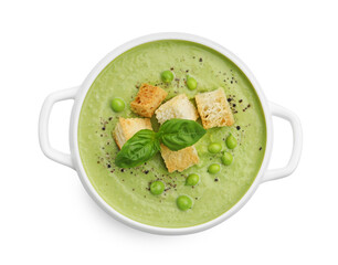 Tasty pea cream soup with croutons and basil isolated on white, top view