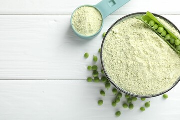 Protein powder and green peas on white wooden table, flat lay. Space for text
