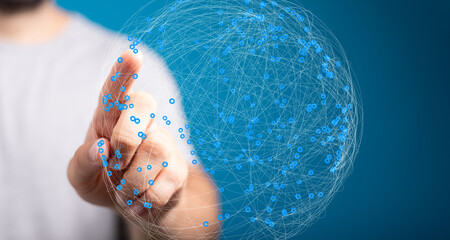 Abstract image of a hand interacting with a digital globe, representing global connectivity and...
