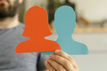 Two paper cutouts representing a team, symbolizing partnership and collaboration.
