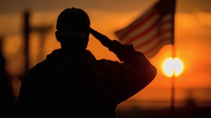 Silhouette of a service member saluting in front of an out-of-focus flag and sunset sky. A moment of respect for freedom and sacrifice.