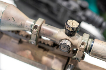 Hunting rifle scopes on display at a show