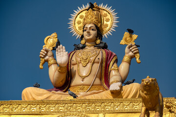 Statue of Hindu Lord Vishnu in Meditative Sitting Pose at Ancient Temple