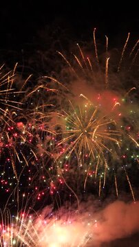 festive fireworks sky, happy fire colored smoke, party festive happy fireworks, fireworks show, colorful explosions, holiday pyrotechnics, bright celebration, celestial fireworks, sparkling night