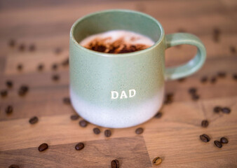 Coffee cup with Dad text and coffee beans