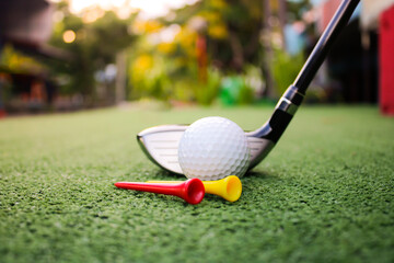 Golf Equipment on Turf with Ball and Tees Ready for Play