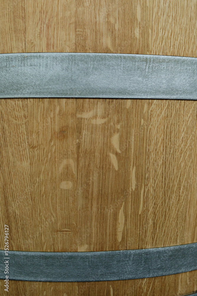 Poster high-resolution image of a rustic wooden barrel with metal bands. perfect for backgrounds or texture