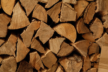 Close-up of neatly stacked firewood logs. Perfect for winter themes, rustic backgrounds, or fuel...