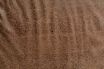 High-resolution image of brown leather texture. Perfect for backgrounds, designs, and more.