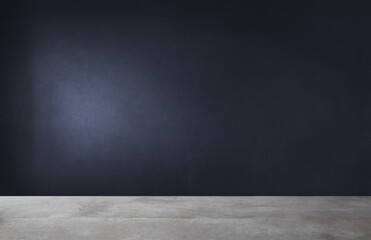 There is an empty room that features a black wall and has a concrete floor