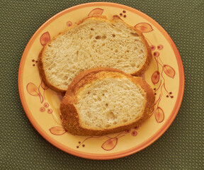 Two slices of sourdough bread on a bread and butter plate!
