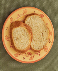 Two slices of sourdough bread on a bread and butter plate!
