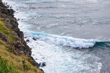 Waves crashing on rocks. Azores, region of Portugal.