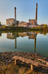 Derelict Factory Reflection in Calm Water