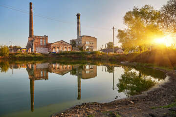 Derelict Factory Reflection in Calm Water