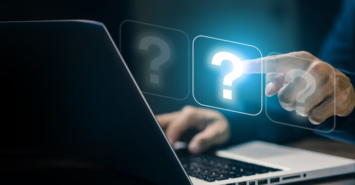 Businessman touching a virtual question mark icon on screen. Concept of online help, digital support, FAQ, inquiry, customer service, and troubleshooting in modern technology.