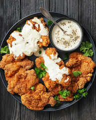 Deep fried Southern chicken thighs with milk gravy