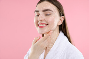 Beautiful woman with perfect skin after collagen treatment on pink background. Lines on her face...