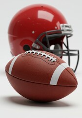 Red Helmet and Football Wallpaper - American football, sport, competition, victory, teamwork. A red helmet and a brown football symbolize athleticism and the thrill of the game