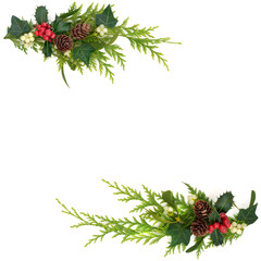 Winter nature greenery of holly red berries, cedar fir and mistletoe on white background. Minimal...