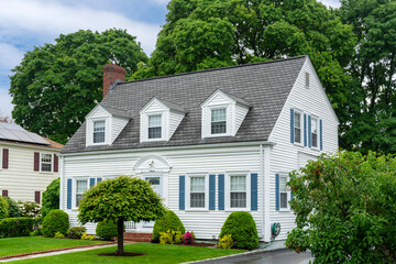 Elegant Colonial Revival home surrounded by lush greenery in Newton, Massachusetts, USA