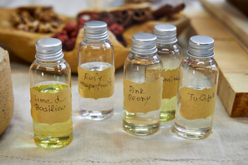 A creative workspace with tools, wax, dried flowers, and a ceramic bowl during the process of making a handmade candle. A cozy and aesthetic DIY moment