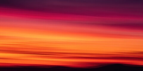 The vibrant sunset displaying a stunning gradient of warm colors across the sky.