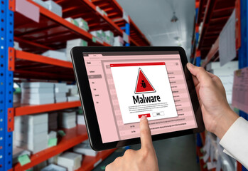 Cyber attacking concept. Malware alert showing on computer screen display scam and threat detection on computer system or online server to be removed snugly.