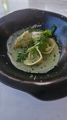 Seafood tortellini with pesto sauce in plate ready to eat